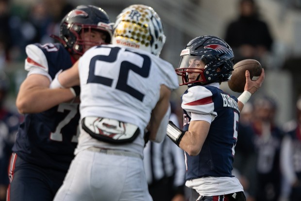 Quarterback Kellen Behrendsen (5) of the Dakota Ridge Eagles looks to pass before a touchdown thrown to Leo Lukosky (3) during the 4A high school football state championship game against the Palmer Ridge Bears on Saturday, Dec. 6, 2025, at Canvas Stadium in Fort Collins, Colo. (Photo by Timothy Hurst/The Denver Post)