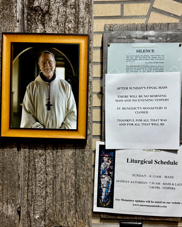 The notice board outside the chapel at St. Benedict's Monastery announces the final Mass. The photo is of Abbot Joseph Boyle who led the community for 33 years before his passing in 2018. (Photo courtesy of Monica Costello)