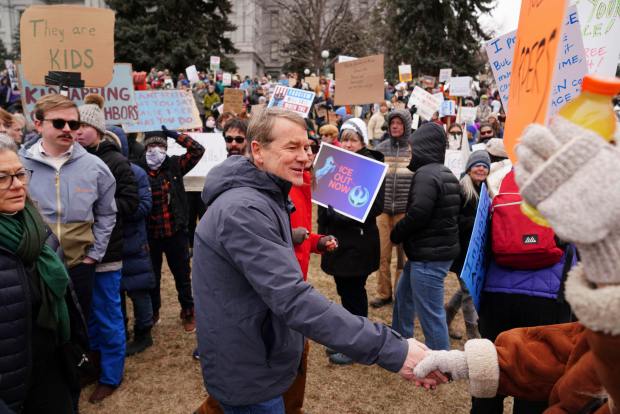 DENVER, JANUARY 25: Colorado Senator Michael Bennet walks through the crowd talking to protesters outside the Colorado State Capitol, Sunday January 25, 2026 in Denver. Crowds came out in response to protest against ICE in light of the death of Alex Pretti in Minneapolis. (Rebecca Slezak/Special to The Denver Post)